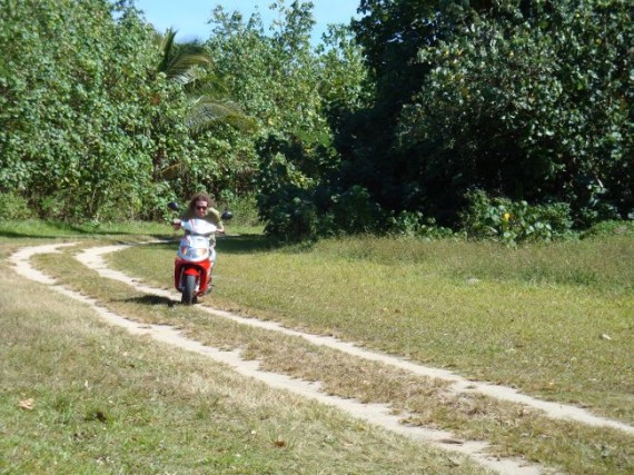 Simon mopeding around Aitutaki