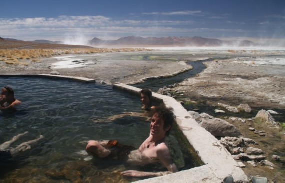 Simon soaking in hot springs on salt flat tour