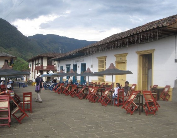 Cafes line Jardin's plaza, Colombia
