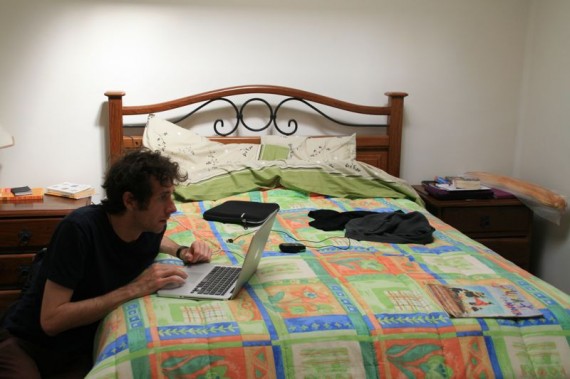 Working on a bed as a digital nomad