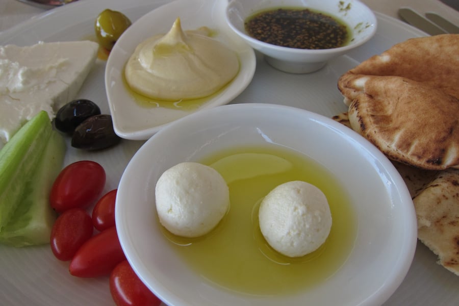 Labneh balls at the front with other Jordanian breakfast dishes
