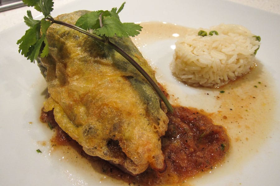 Chiles Rellenos with salsa and rice