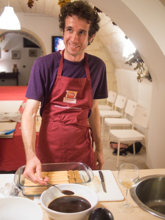 Simon adding coffee to the biscuits for tiramisu