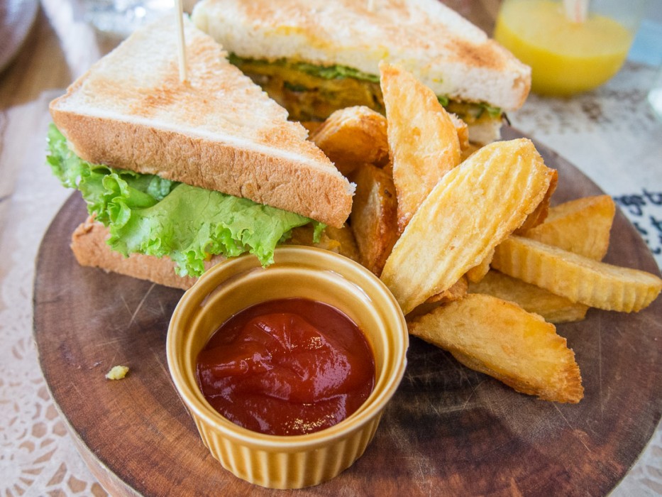Vegetarian club sandwich and chunky chips at Sister Srey