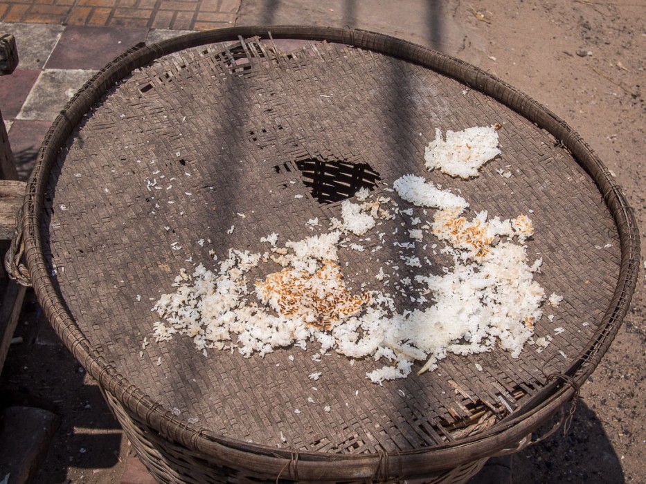 Drying rice by the side of the road, Cambodia