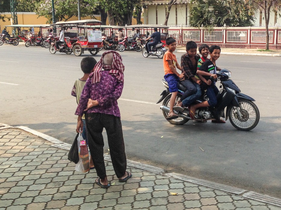 Kids driving motorbike in Cambodia