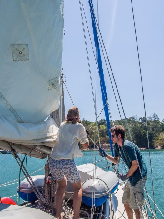 Simon and Marie hoisting the mainsail, langkawi sailing school