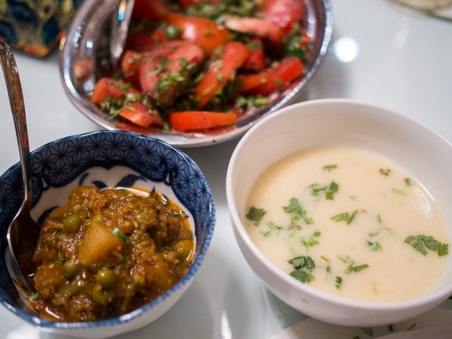 Fenugreek kofta in curry, tomato salad, and kadhi (yoghurt soup)