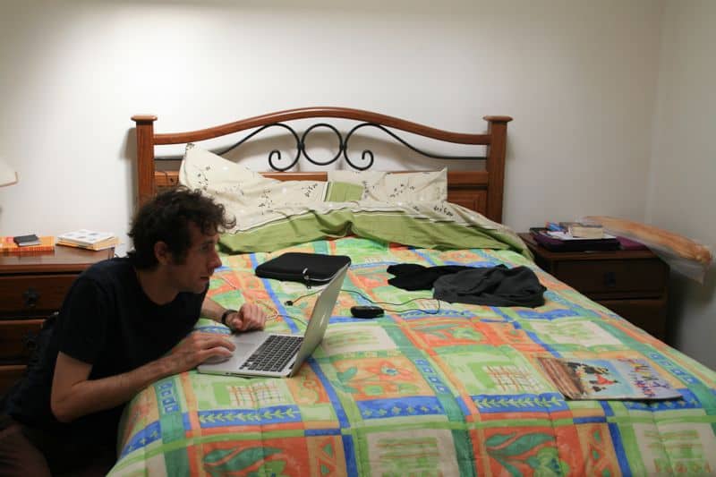 Working on a bed as a digital nomad