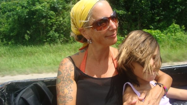 Lainie and Miro in a pick up truck in Belize