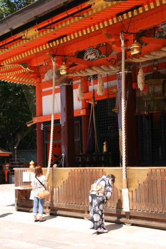 Praying at Yasaka-jinja