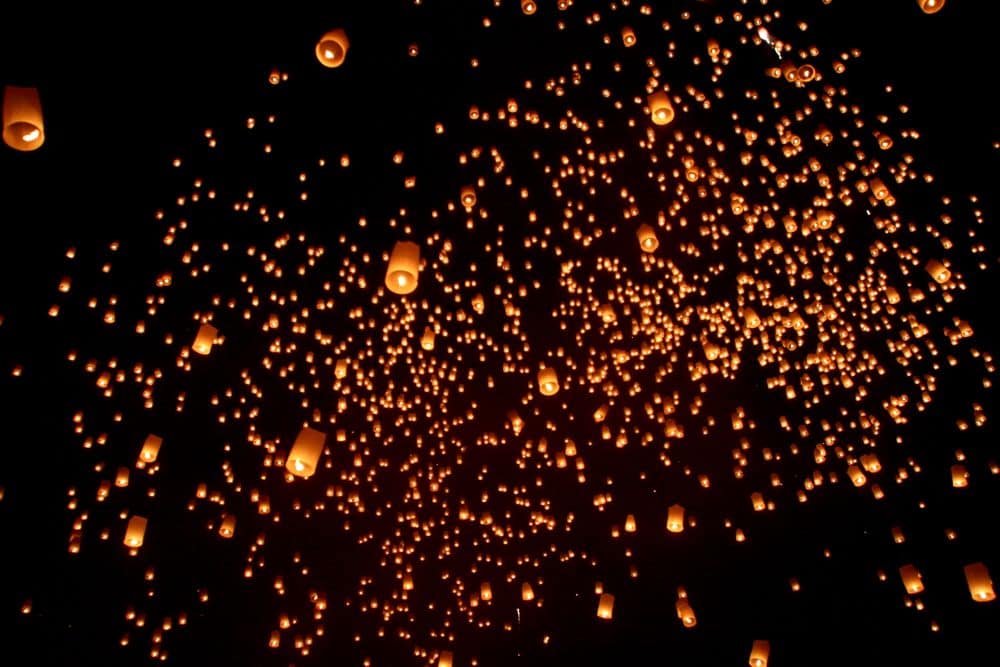 Yee Peng lanterns drifting away