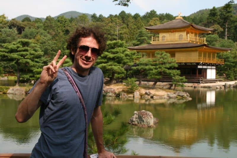 Simon making a peace sign at Golden Temple, Kyoto