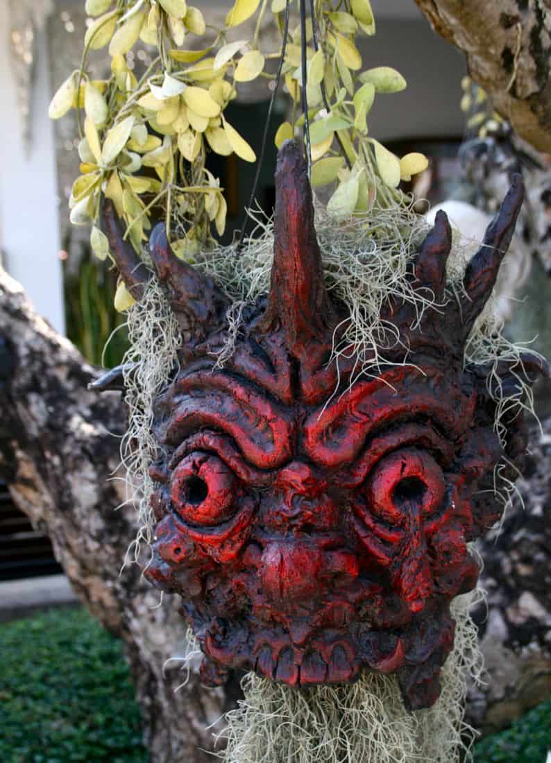 Red head on tree, White Temple, Chiang Rai