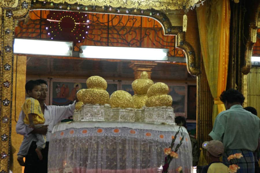 Gold leaf coated Buddhas at Phaung Daw U Pagoda