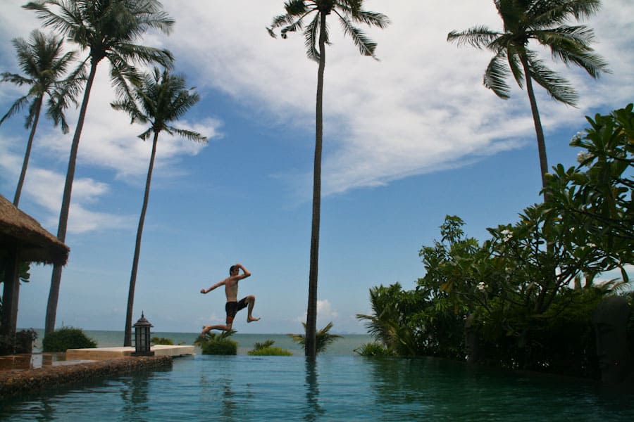 Simon jumping in the pool