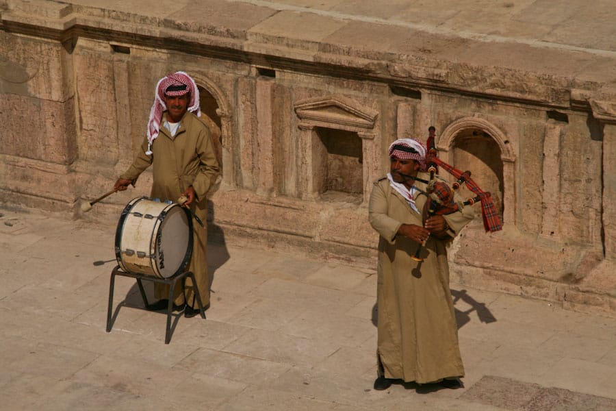 Bagpipers at Jerash in traditional Jordanian men's tunic and kaffiyeh Bagpipers at Jerash in traditional Jordanian men's tunic and kaffiyeh
