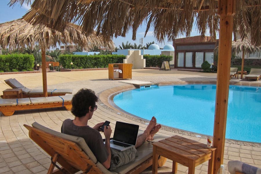 Simon working by the pool in Dahab, Egypt