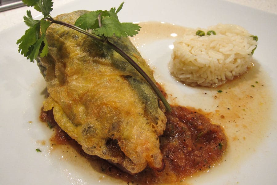 Chiles Rellenos with salsa and rice Chiles Rellenos with salsa and rice