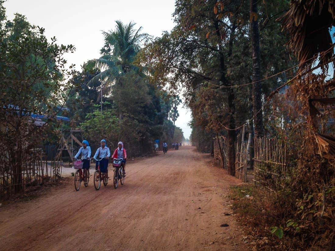 Girls cycling in countryside outside Kampot