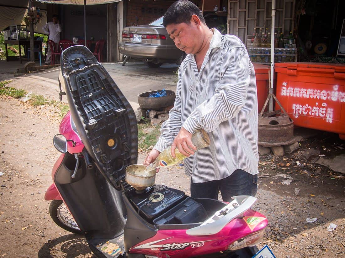 Cambodian petrol station using Pepsi bottles