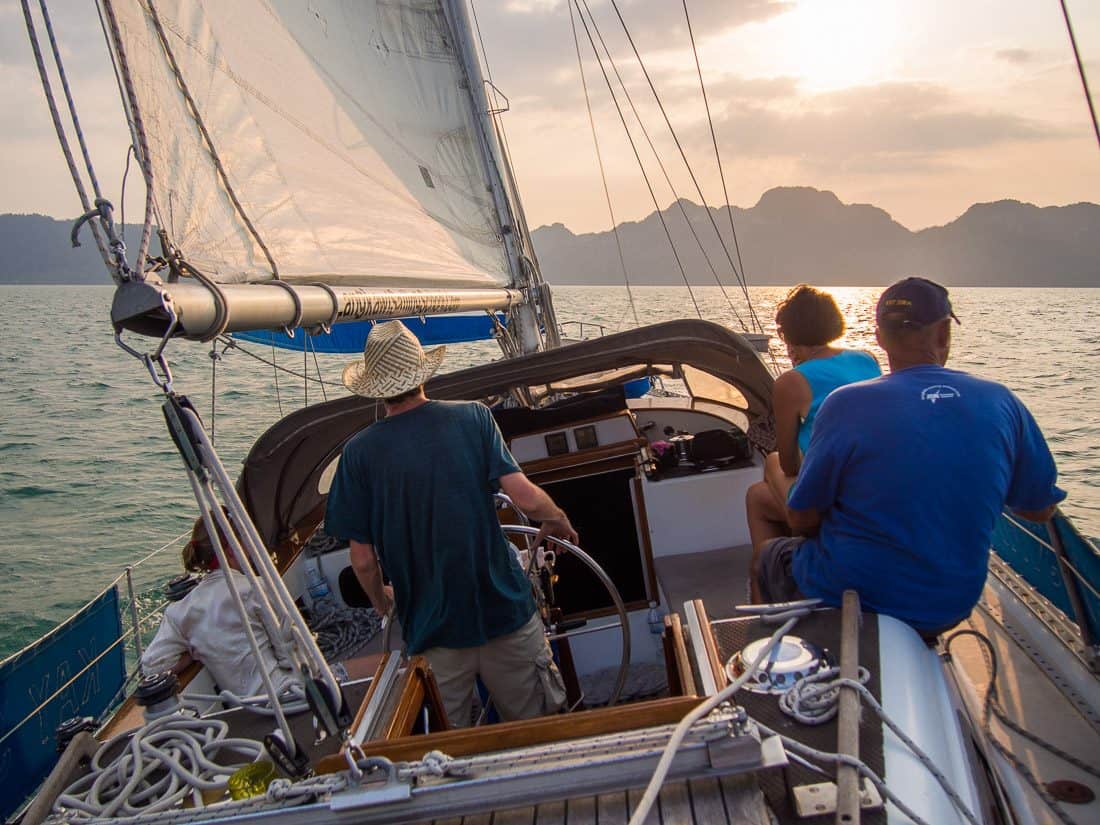 Simon sailing into the sunset on Kay Sira, Langkawi sailing school