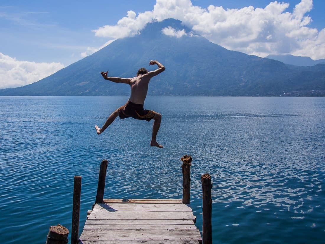 Simon jumping from dock at Apartment at Pasajcap, San Marcos, Lake Atitlan