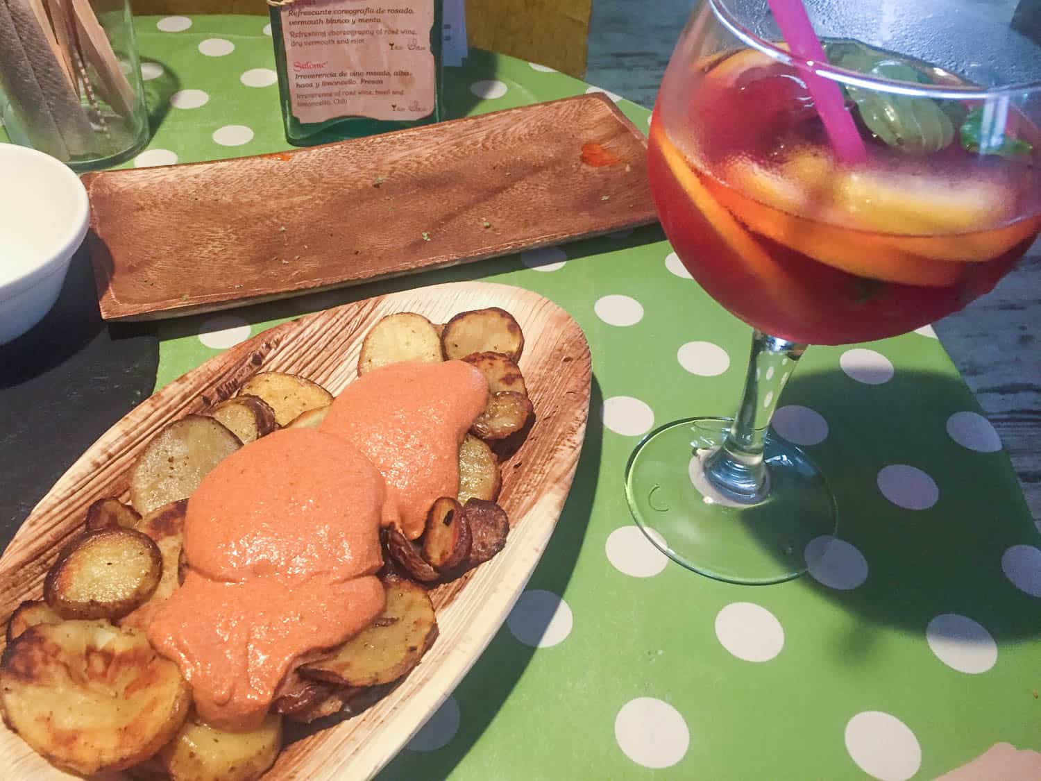 Patates Braves with a large glass of Sangra in Bubita bar, Barcelona