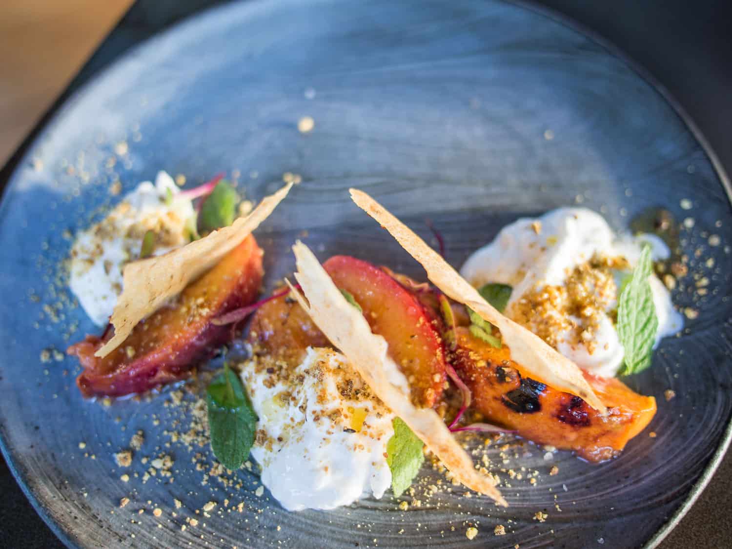 Burrata, grilled nectarines and pistachio dukkah from the vegetarian tapa menu at The Pot Luck Club in Cape Town