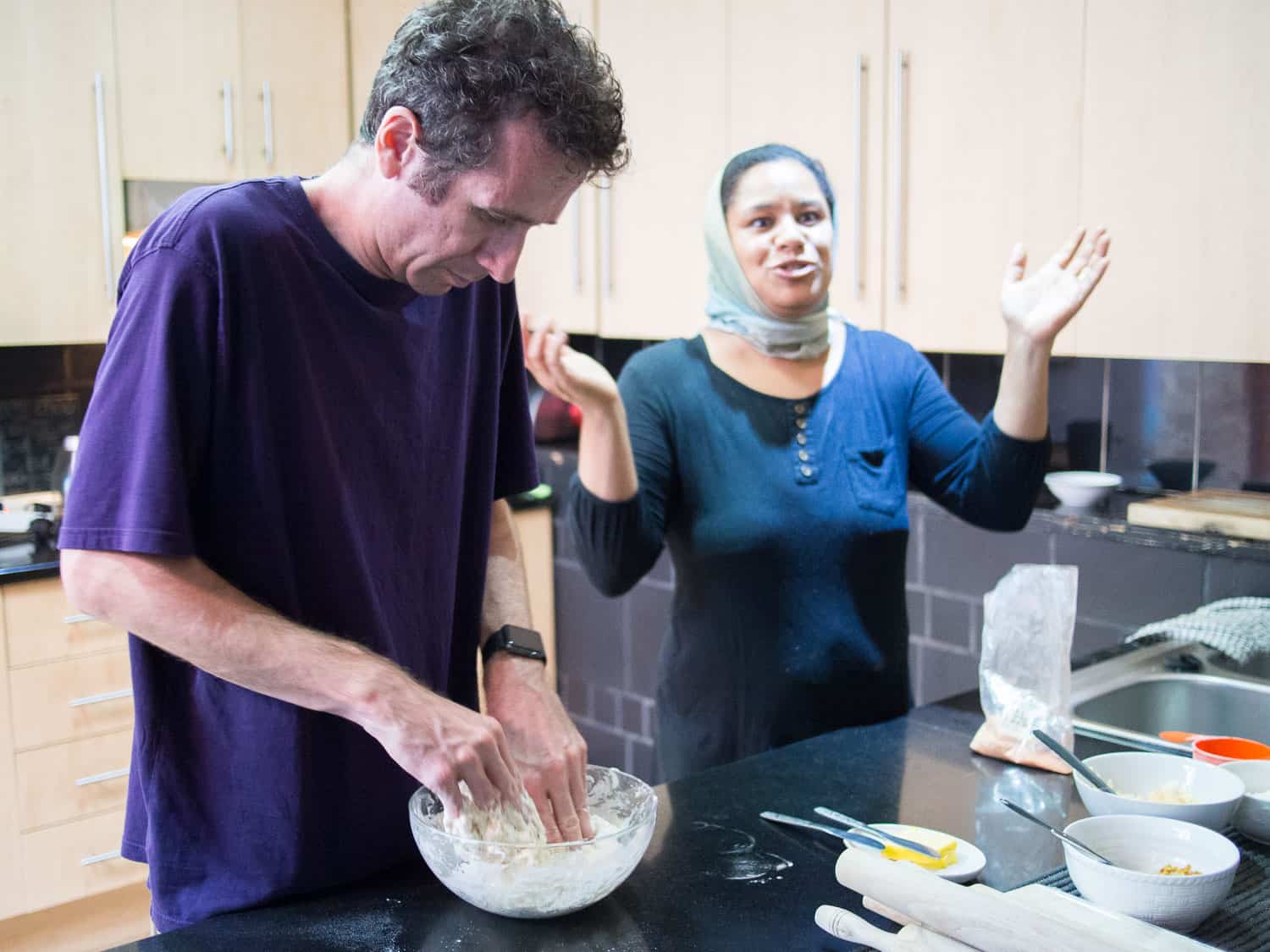 Simon making roti dough with Gamidah on the Lekka Kombuis cooking class in Bo-Kaap, Cape Town