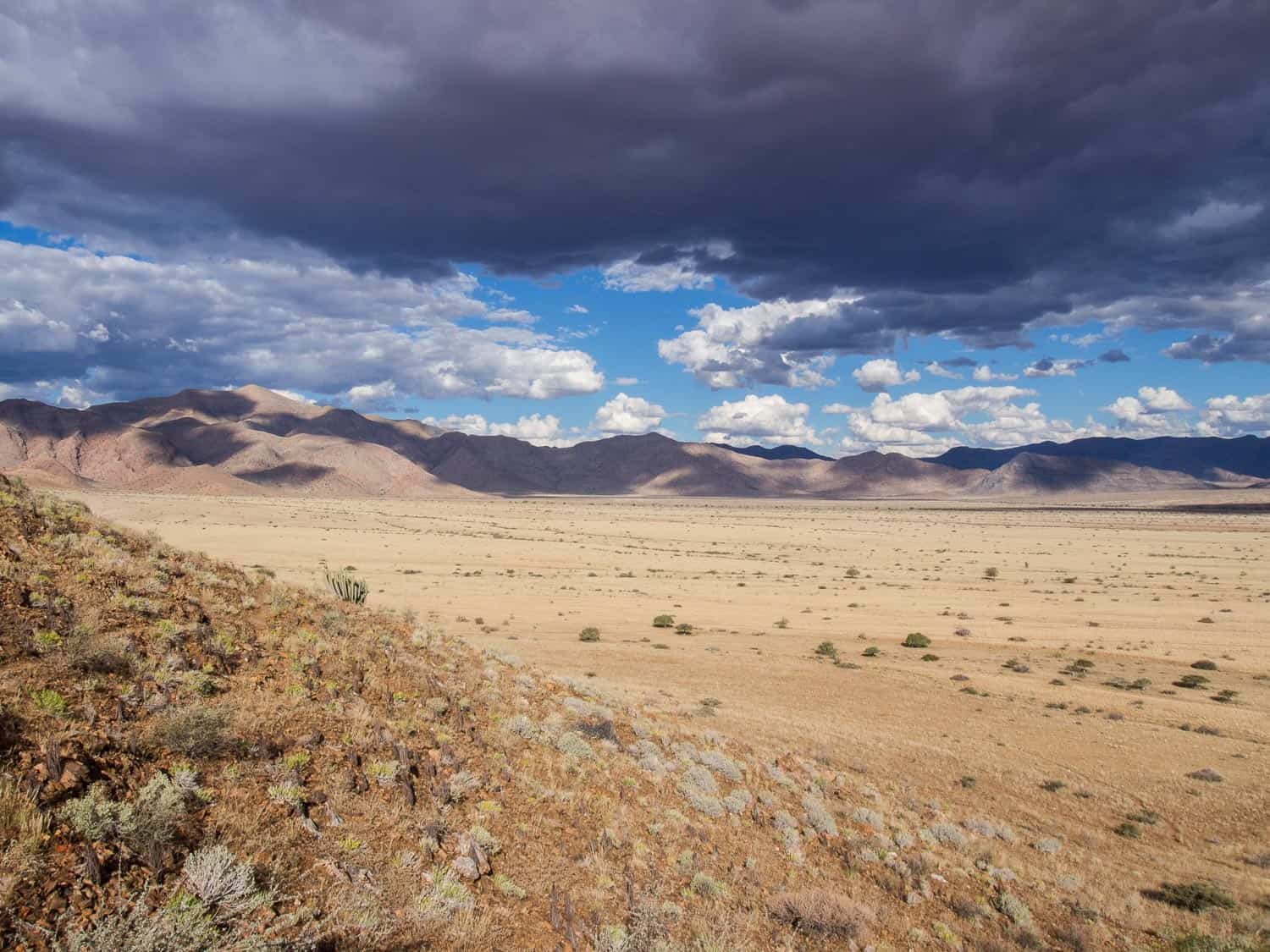 Stormy skies in the Namib desert on our Namibia self drive road trip.