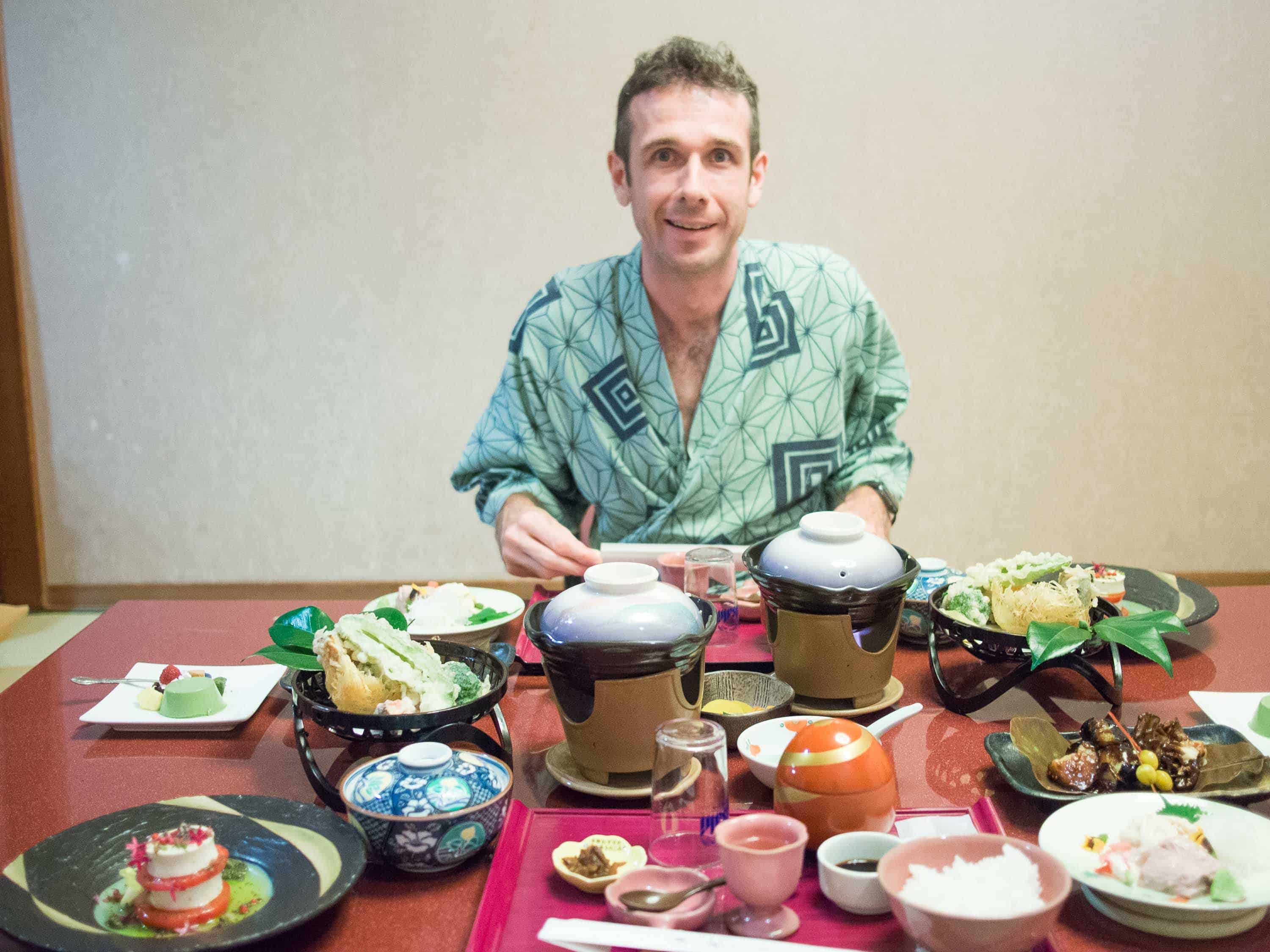 Simon wearing a yukata and enjoying our vegetarian feast in our ryokan room in Hakone
