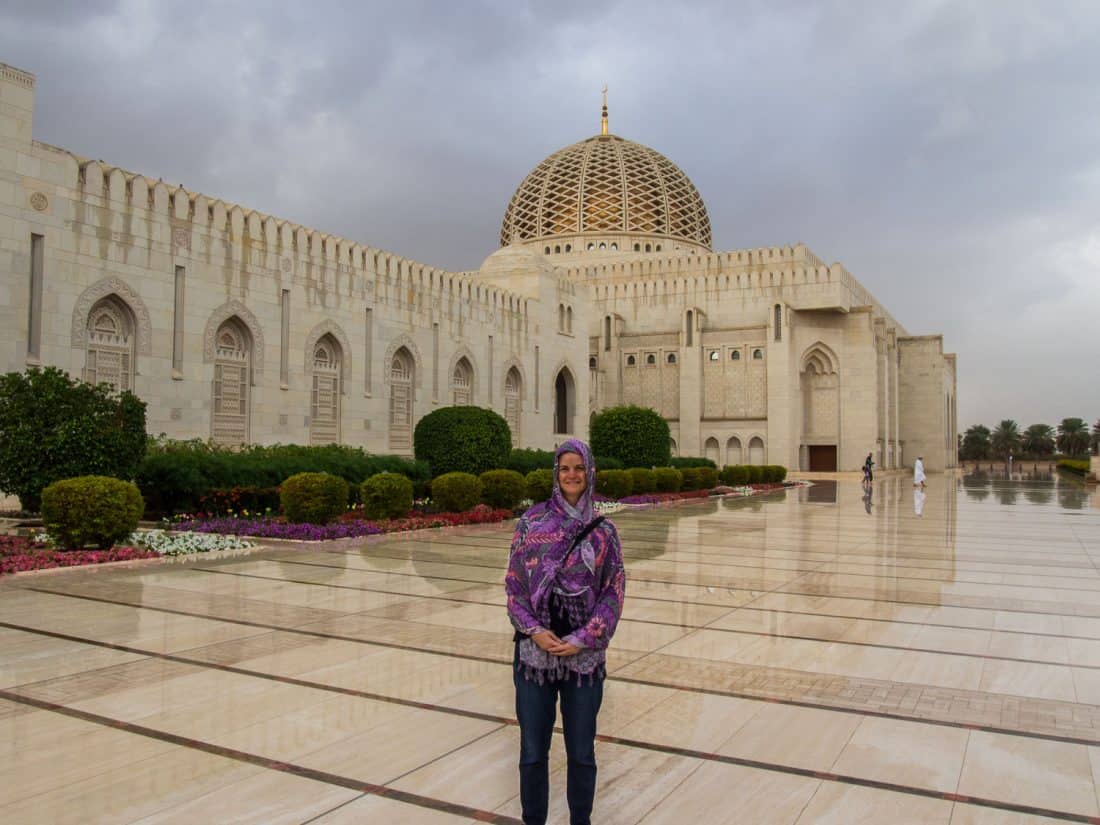 Erin wearing a sarong as headscarf plus long sleev shirt and jeans at the Grand Mosque in Muscat