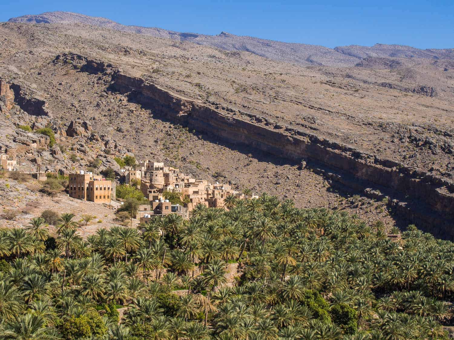 Misfat Al Abriyeen surrounded by mountains and lush date and banana plantations, Oman