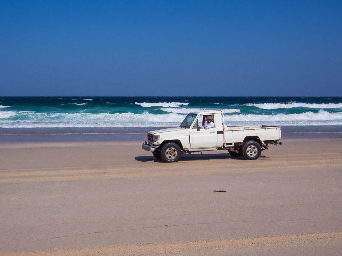 Truck driving on Ras Al Hadd beach, Oman