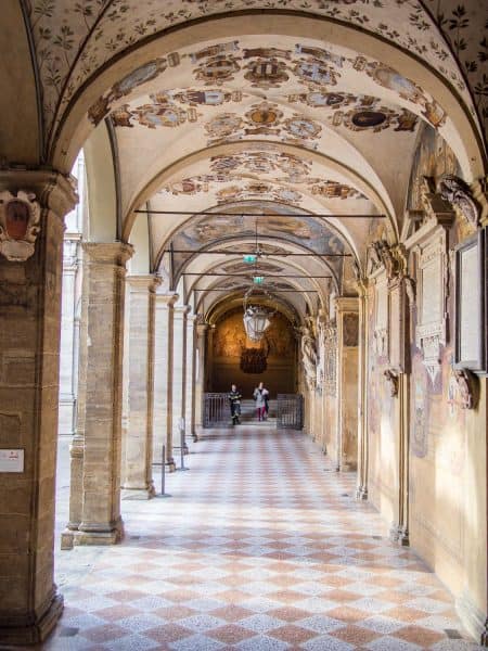 The gorgeous fresco covered porticos in the courtyard of the Archiginasio, Bologna University