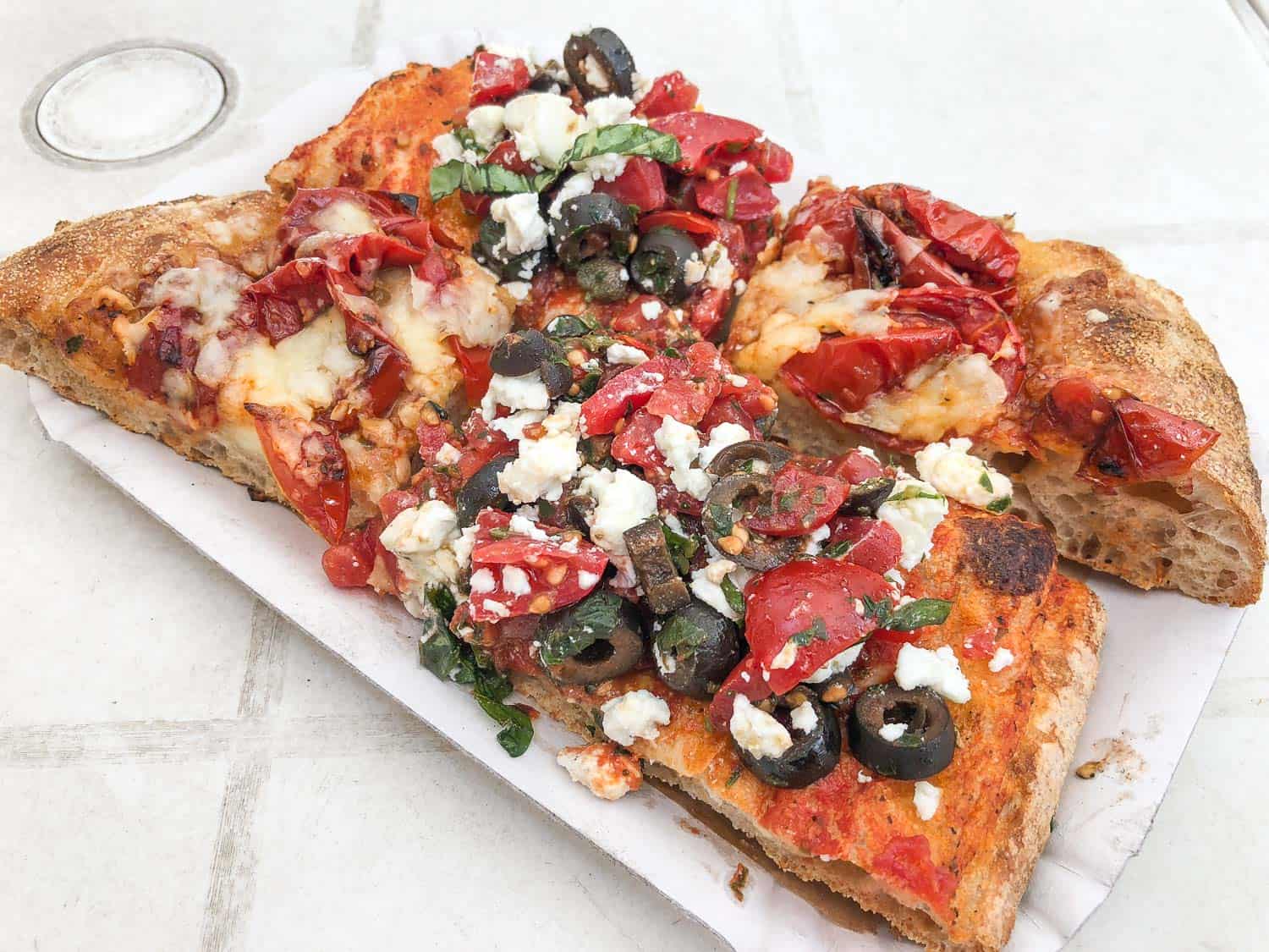 Pizza slices at CasaManco stall in Testaccio Market in Rome, Italy