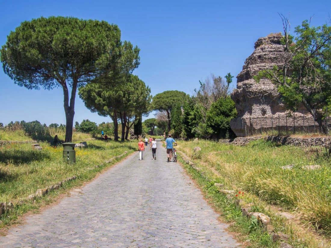 People strolling along the Appian Way in Rome, Italy