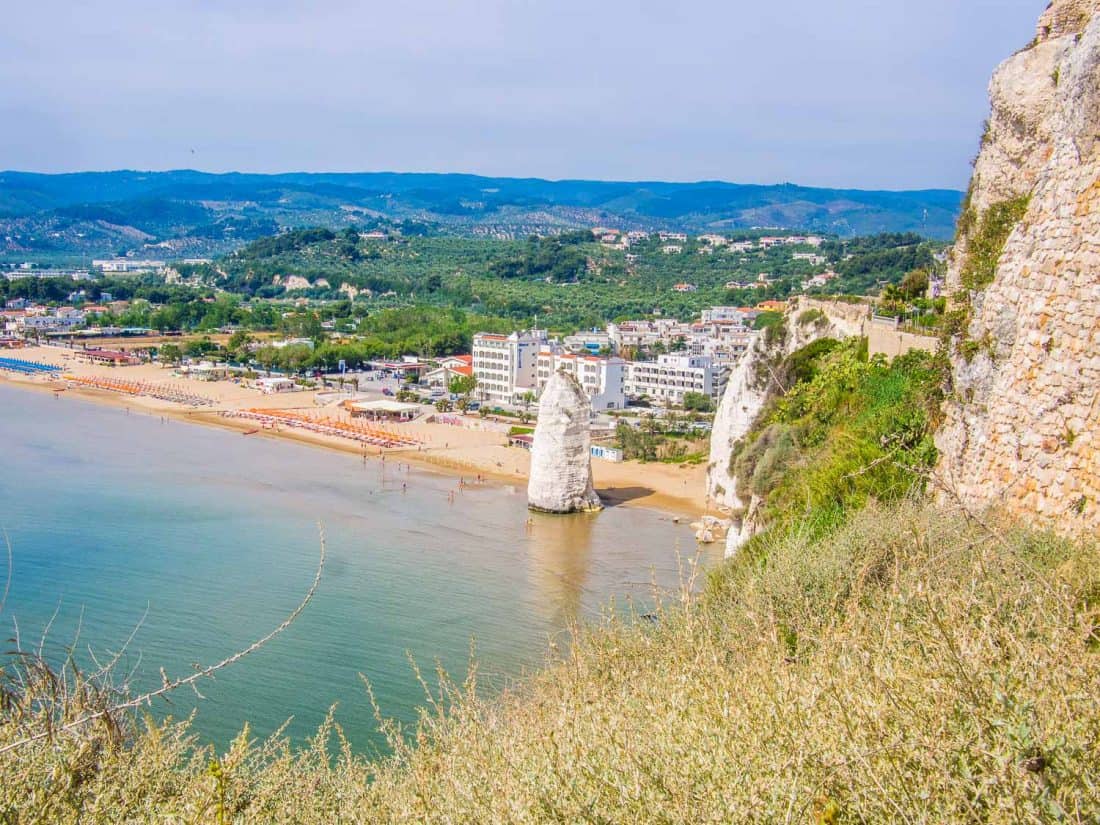 View of Castello Beach and the Pizzomunno rock from the castle in Vieste Italy