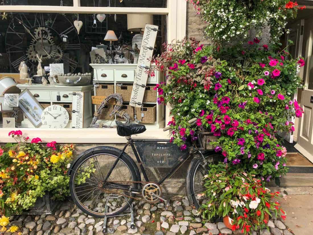Antique shop with flowers, Grassington village in the Yorkshire Dales, England