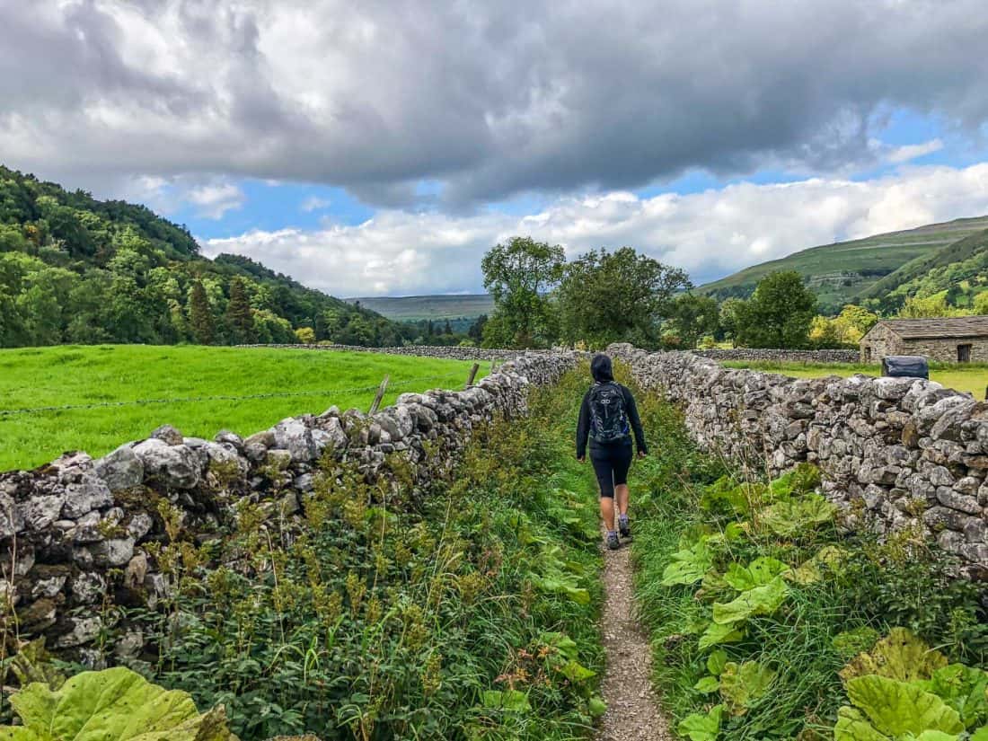 Erin walking from Kettlewell to Hubberholme on the Dales Way, Yorkshire Dales, England