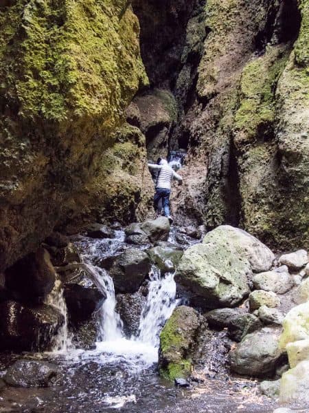 Climbing inside Rauðfeldsgjá Gorge in Snaefellness Iceland