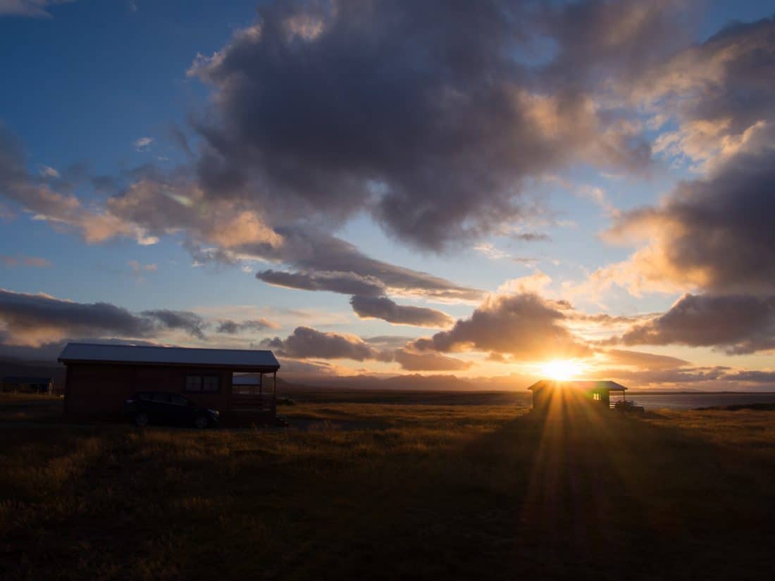 Cabins overlooking the sea at sunrise at Tradir Guesthouse on the south coast of the Snaefellsness Peninsula, Iceland