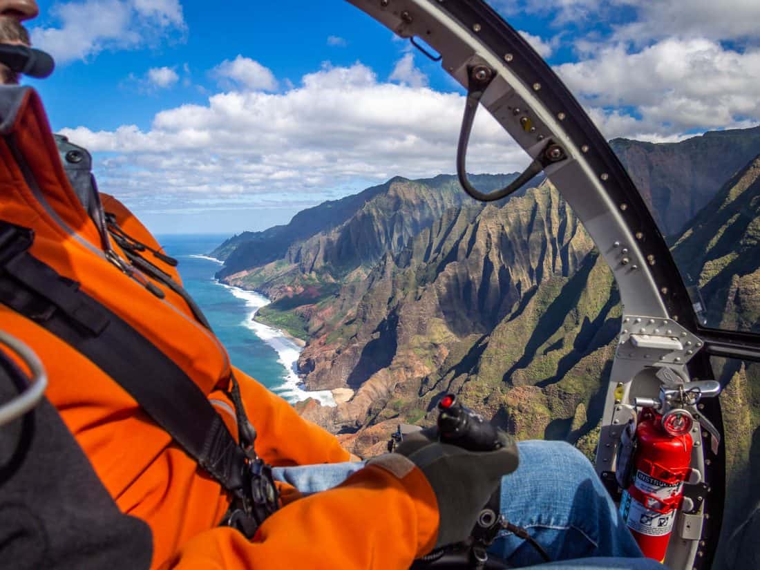 The pilot flying over the Napali Coast in Kauai on a Jack Harter doors off helicopter trip in Hawaii