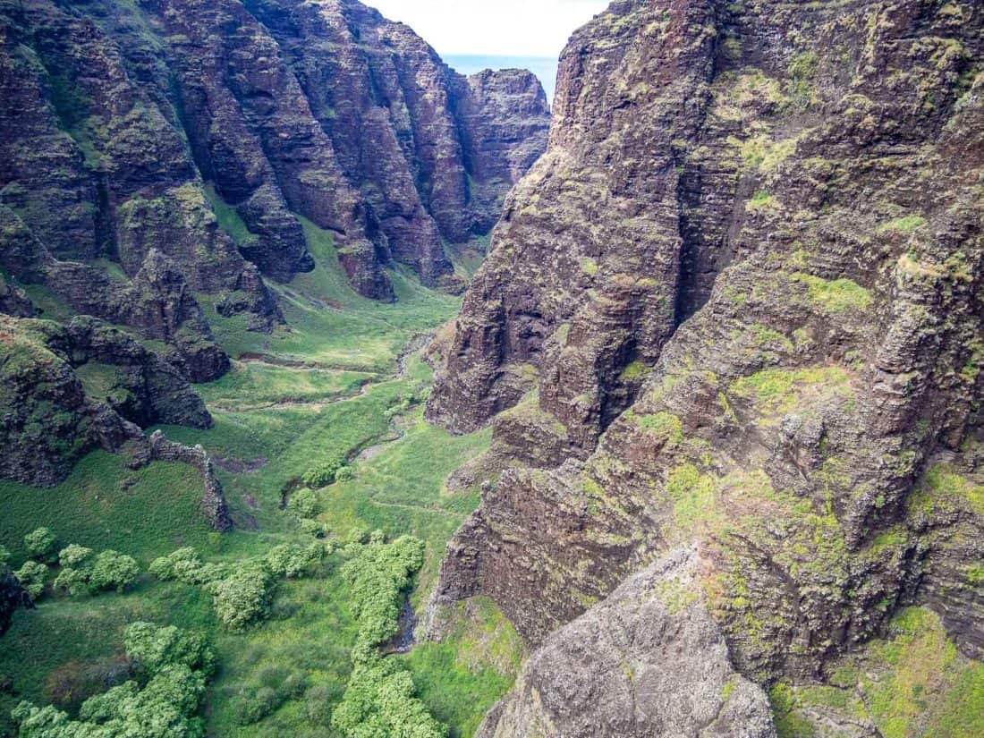 Flying into one of the Na Pali coast's inlets in Kauai on a Jack Harter doors off helicopter trip in Hawaii