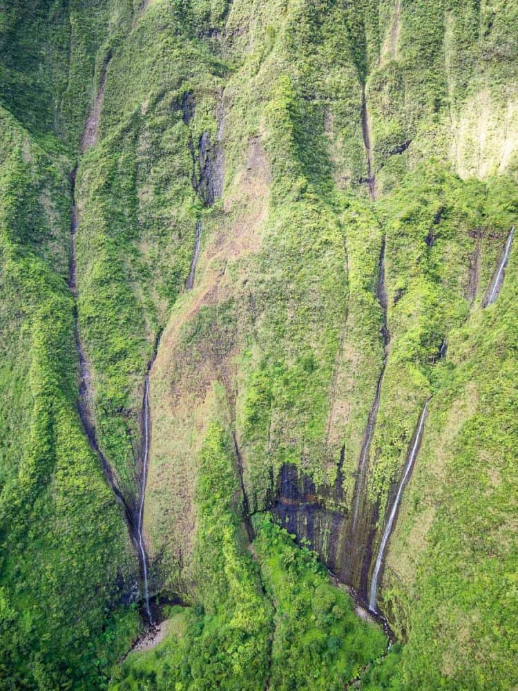 Waterfalls at Mount Waialeale on a doors off helicopter Kauai tour with Jack Harter