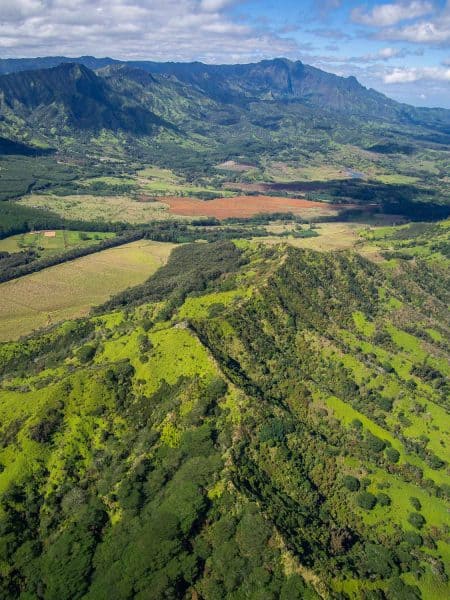 Flying over the mountains of southern Kauai on our Jack Harter doors off helicopter tour