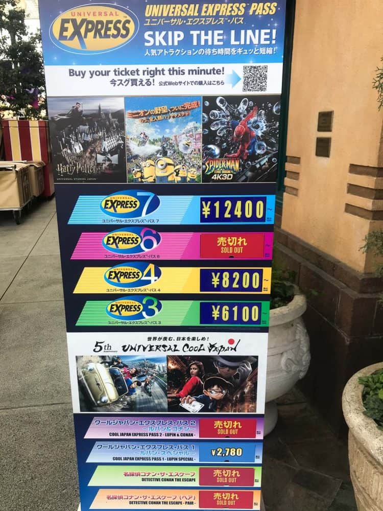 Express Pass sign in Universal Studios Japan showing the different pass options still available within the park on a visit in February