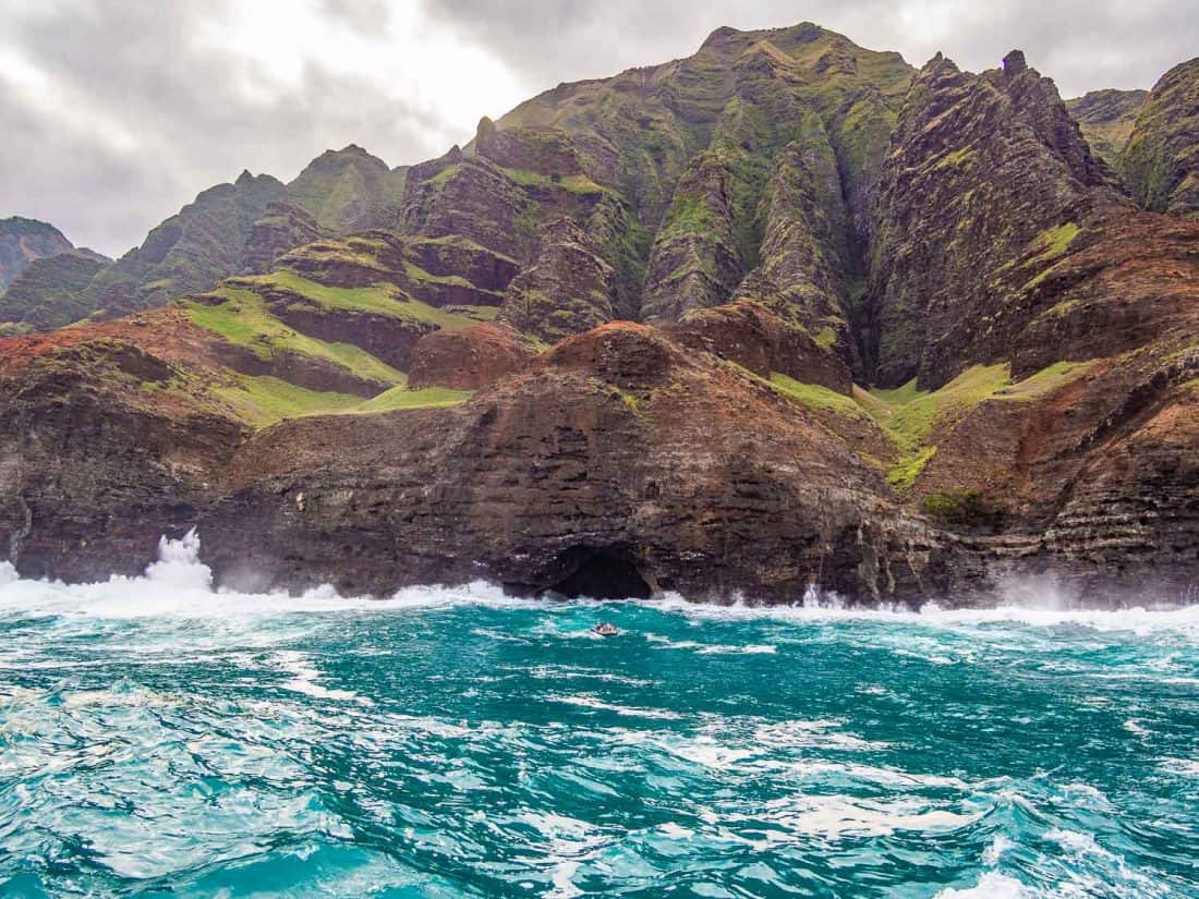 Small boat in big waves on the the Napali Coast in Kauai