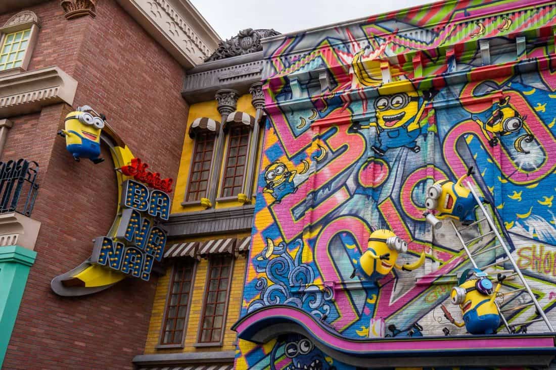 Minions climbing the graffiti wall of Hotel Banana at Minion Park in Universal Studios Japan in Osaka